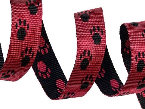spiral-of-25mm-webbing-red-and-back-double-sided-polypropylene-webbing-with-red-and-black-paw-prints