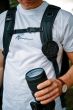 fidlock-lens-cap-clip-attached-to-bag-strap