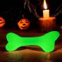 sodapup-glow-in-the-dark-bone-lit-up-in-the-dark-with-a-halloween-background